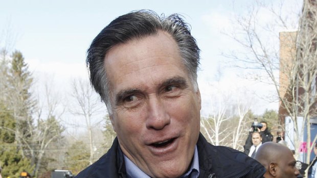 Republican presidential candidate, former Massachusetts Governor Mitt Romney, gives a thumbs up as he campaigns on primary election day in Manchester, New Hampshire.