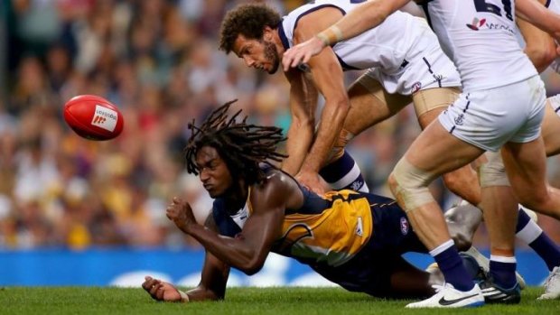 Nic Naitanui gets a ahandball away during the round seven match against Fremantle.