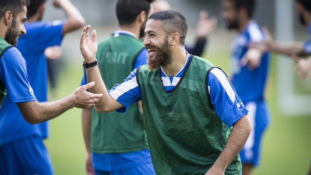 Kuwait midfielder Aziz Mashaan in good spirits with his teammates at a training camp at the AIS on Sunday.