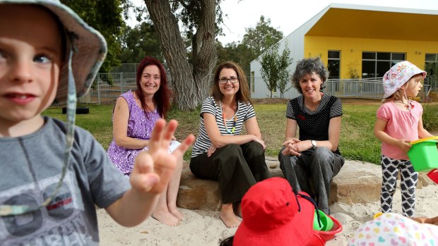 Where it all began: Jennifer Gottliebsen, left, Anne Miles and Leanne McCoy in the sandpit at Brunswick Montessori Children's House that they brought from concept to opening. 
