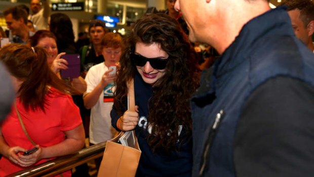 Lorde arriving at Auckland International Airport after the Grammys was earlier seen waving and smiling.