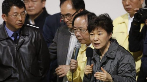 South Korean President Park Geun-hye speaks to family members of the lost at the Danwon High School gym.