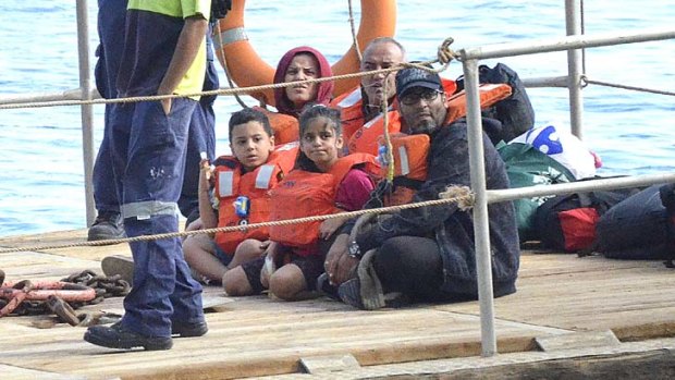 Hard line ... asylum seekers arriving at Christmas Island on Monday. The Immigration Minister said exemptions for women or children would be exploited by smugglers.