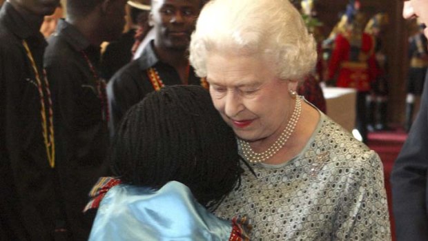 One is pleased ... Queen Elizabeth gets a hug from Lydia Amito.