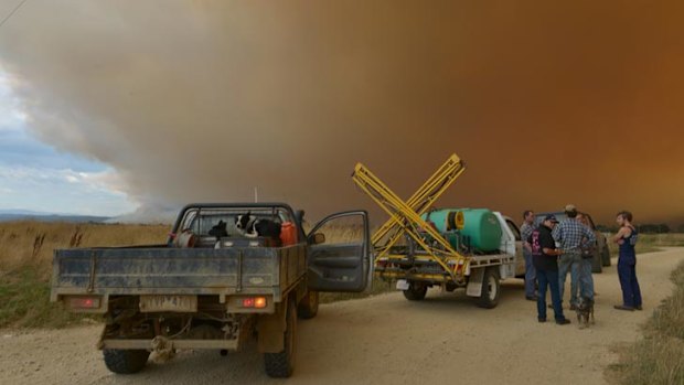 Locals gather near the firefront at Dawson.