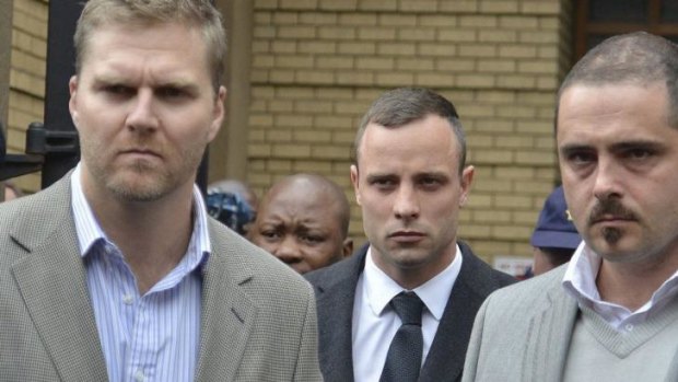 'I did not fire at Reeva!' ...South African Paralympic star Oscar Pistorius (centre) screamed this response at Mr Nell in court. 