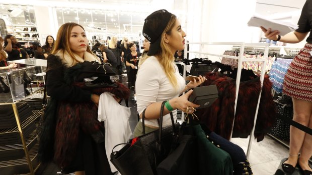 Women queue at the registers at H&M's Sydney store.
