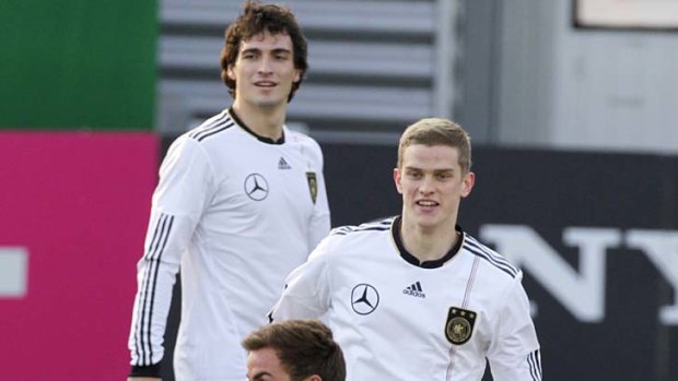Bright future: German players Mario Goetze (front), Sven Bender (centre) and Mats Hummels (behind) are part of a wave of talent coming through for coach Joachim Loew who wants to be part of the ride.