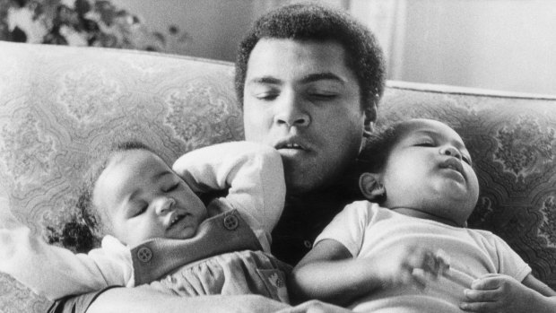 19th December 1978: Heavyweight boxer Muhammad Ali with his daughters Laila (9 months) and Hanna (2years 5 months) at Grosvenor House. 