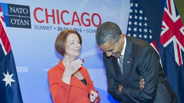 Catch up ... Julia Gillard and Barack Obama. Australia pledged $100 million a year for Afghanistan forces for three years from 2015.