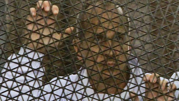 Al-Jazeera journalist Peter Greste inside an Egyptian courtroom's defendants' cage earlier this month.