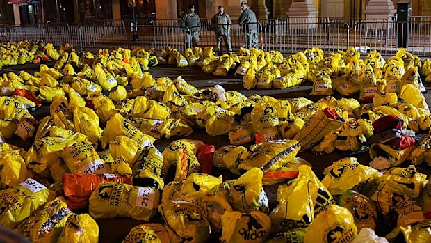 Unclaimed runners' bags lie near the scene of the bomb blasts.