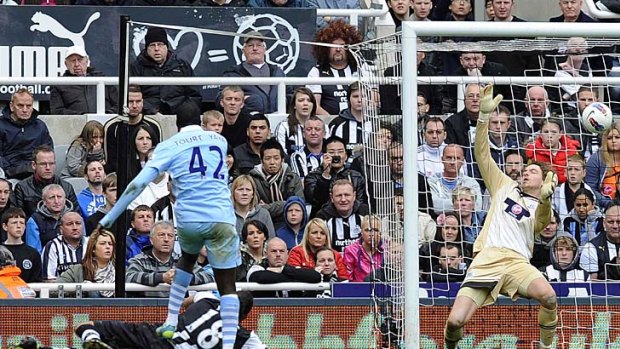 Manchester City's Yaya Toure scores against Newcastle United.