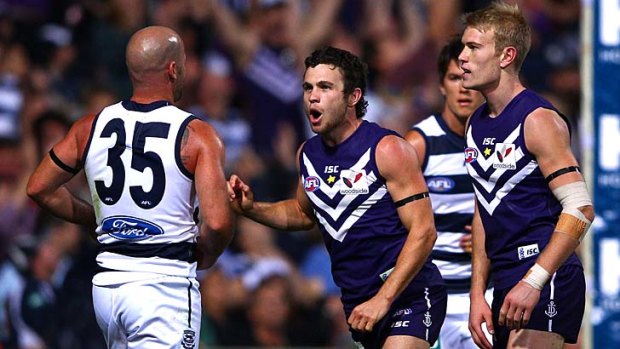 Hayden Ballantyne gets in Paul Chapman's face during the round one game between the Cats and the Dockers.