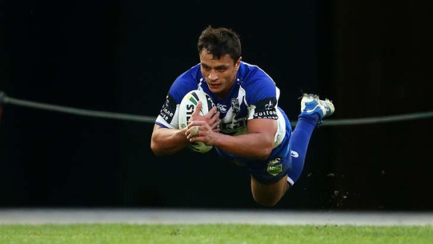 Triple treat: Sam Perrett scored three tries for the Bulldogs in their 39-0 romp over the Storm.
