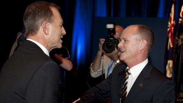 Confident &#8230; Mr Abbott congratulates Mr Newman after his speech at the campaign launch yesterday.