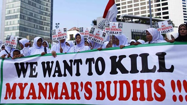 People from Indonesian Muslim hardline groups protest near the embassy of Myanmar in Jakarta.