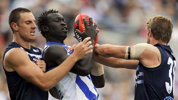 Debut looming? ... Majak Daw marks between two Geelong opponents during the NAB Cup.