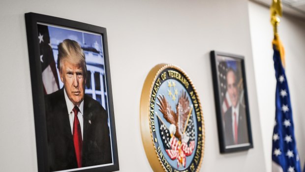 A framed portrait of President Trump - downloaded from the White House website - hangs in the lobby of the Department of Veterans Affairs offices in Washington.