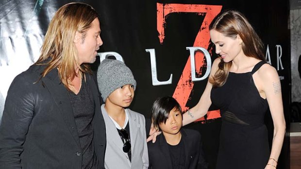 Jetsetters: Angelina Jolie with children Maddox Jolie-Pitt (left) and Pax Jolie-Pitt and partner Brad Pitt at the World Premiere of <i>World War Z</i> in London in June.