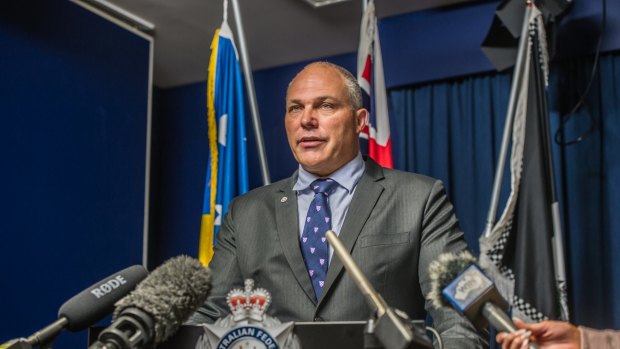 ACT Policing Detective Superintendent Scott Moller fronts media on Monday following the discovery of three bodies in a burnt-out Bonner house.