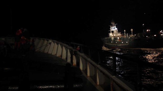 A Japanese harpoon ship passes at speed near the Sea Shepherd ship Bob Barker.