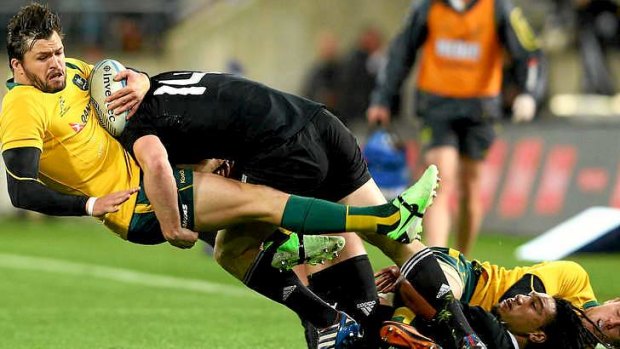 Adam Ashley-Cooper on the receiving end of an All Black tackle during Saturday's Bledisloe Cup game.