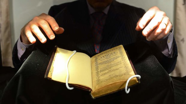 Psalm, I am: a Sotheby's employee handling a copy of the Bay Psalm Book, the first book printed in what is the US in 1640, considered the world's most valuable book.