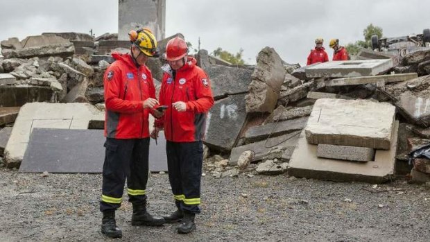 Queensland Fire and Emergency Services workers Graeme Hall and Corey Dennis at the Whyte Island training facility.