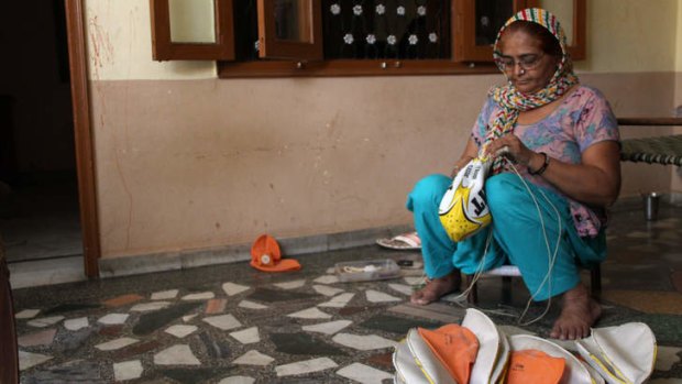 Forty-five-year-old Mala began stitching sports balls when she was 13.