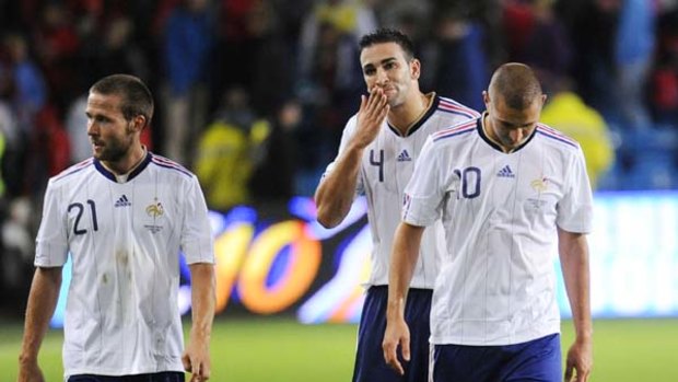 Crestfallen . . . France's Yohan Cabaye, defender Adil Rami and forward Karim Benzema leave the field after being defeated by Norway.