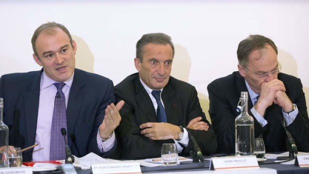 Ed Davey, Britain's energy secretary, left, speaks as Henri Proglio, chairman of Electricite de France SA (EDF), centre, and Vincent de Rivaz, chief executive officer of EDF Energy, right, listen during a news conference to announce a deal to construct a new nuclear power station in Britain.