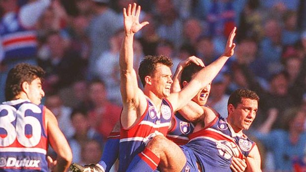 1997 preliminary final. Tony Liberatore believes he has kicked a sealing goal. It is ruled a point.