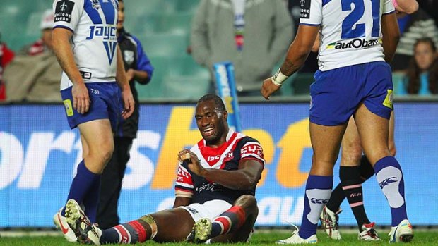 The final injury ... Peni Tagive of the Roosters grimaces after tearing his hamstring against the Bulldogs.