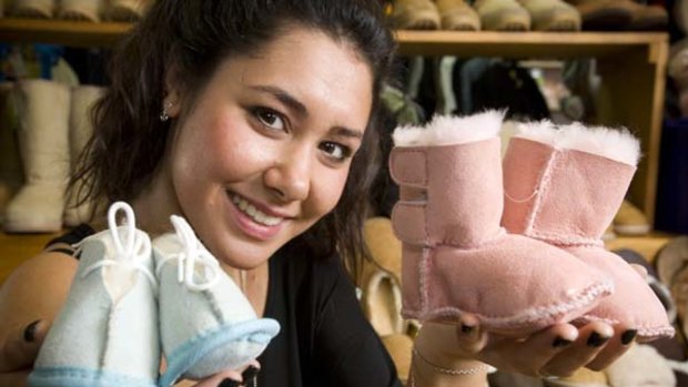 No excuse for cold feet ... Emma Howard displays baby ugg boots fit for Denmark's newborn royal twins in Hobart yesterday.