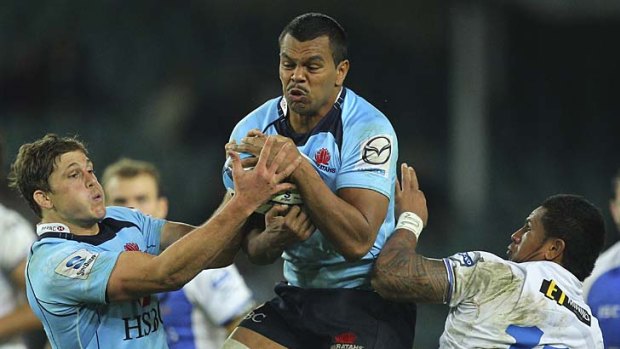 Waratahs fullback Kurtley Beale takes a high ball during the round 12 Super Rugby match against the Western Force.