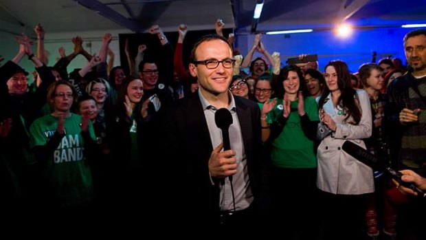 A happy Adam Bandt, who will retain his seat of Melbourne.