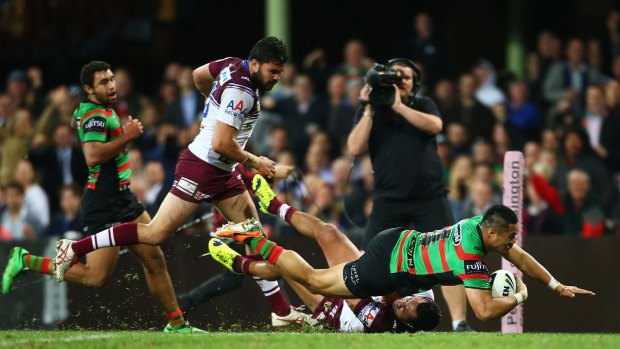 Gone: Kirisome Auva'a of the Rabbitohs scores a try during the season last year but has been edited out of a club video.