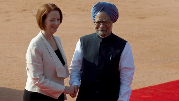 Julia Gillard shakes hands with her Indian counterpart Manmohan Singh.