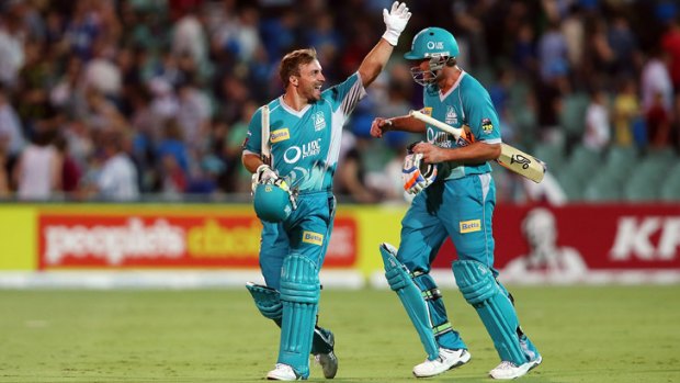 Chris Hartley and Peter Forrest of the Heat celebrate after the Big Bash League match between the Adelaide Strikers and the Brisbane Heat.