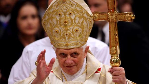 Pope Benedict XVI gives Christmas Night Mass at St. Peter's Basilica last year.