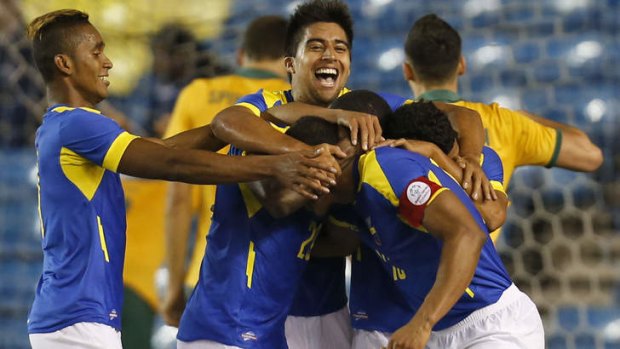 Ecuador's players celebrate their winning goal.