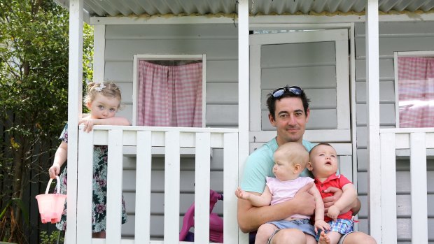 UNICEF child protection specialist Anthony Nolan, on holiday with Edie, two, and nine-month twins, Vivienne and Jack Jorgensen,in Brisbane. 
