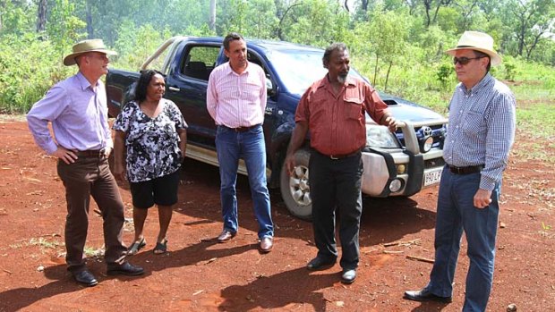 Queensland Premier Campbell Newman, Cheryl Canon, Member for Cook David Kempton, Hope Vale Aboriginal Shire Council Mayor Greg McLean and CEO Ross Higgins discuss the history of the hoursing estate on which Ms Canon will build her new home.
