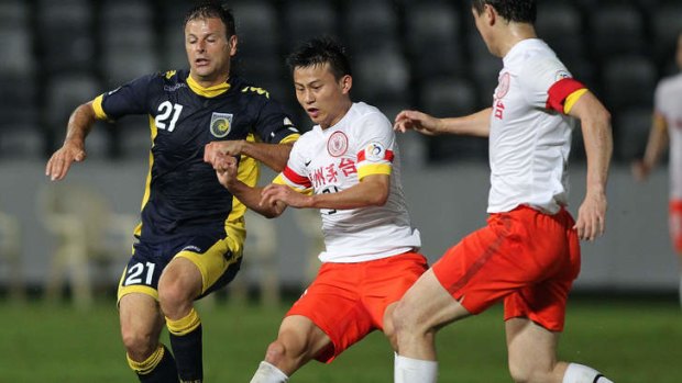 Mile Sterjovski in action against Guizhou at Bluetongue Stadium last year.