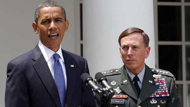 Before the exposure ... General Petraeus, pictured with President Obama before he resigned from his position as CIA director.