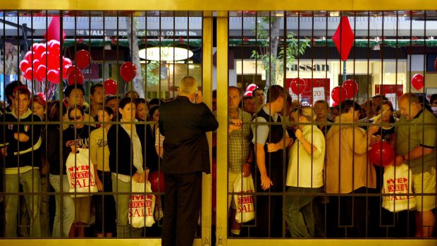 Crowds gather at the 2003 Boxing Day sales. This year, more people than ever are expected to begin their sales shopping online.
