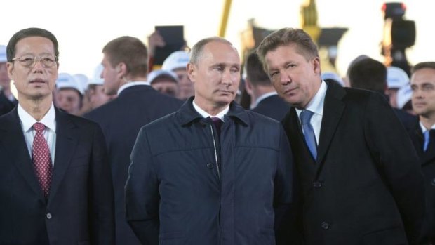 Russia's gas giant Gazprom CEO, Alexei Miller (right), Russian President Vladimir Putin and Vice Premier of the People's Republic of China Zhang Gaoli outside Yakutsk for an event to mark the start of a new gas pipeline.