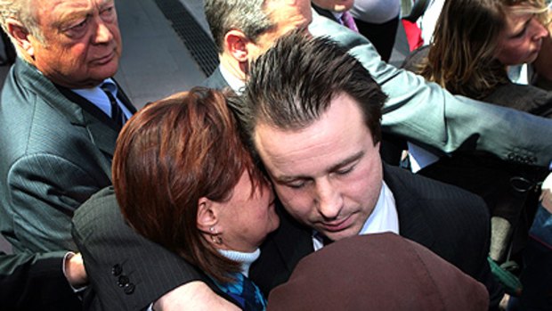Jack Thomas hugs his mother outside the County Court.