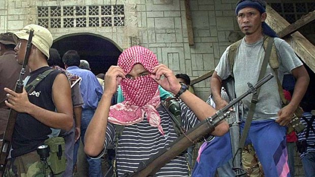 Ruthless criminals &#8230; Abu Sayyaf gunmen guard a mosque on Jolo island, in southern Mindanao.